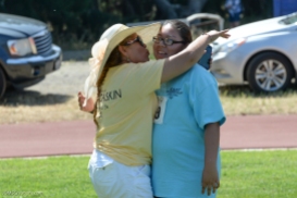 Special Olympics Southern California LA/SGV Pomona Area Games April 22, 2017 mom celebrates with San Gabriel Valley daughter after softball throw hug and kiss